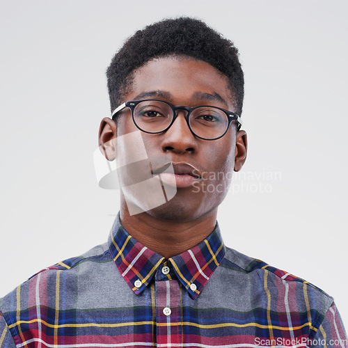 Image of Face portrait, serious nerd and black man in studio isolated on white background. African, geek and male person with glasses from South Africa with fashion, style and pose with clothes for confidence