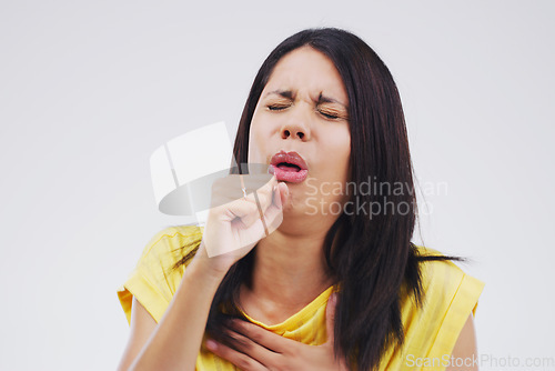 Image of Woman, cough and studio with virus, sick or covid 19 with breathing problem by background. Girl, allergies or tuberculosis with struggle to breathe, asthma and pain in lungs with healthcare challenge