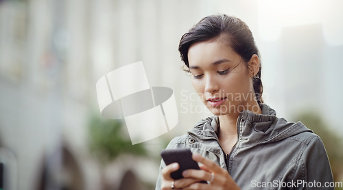 Image of Woman, using phone and social media in the city with communication and technology outdoor. Female person online in urban street, connectivity and chat on mobile app with mockup space and texting