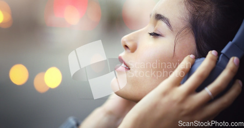 Image of Woman with headphones in city, peace and listening to music, freedom and technology outdoor. Mockup space, podcast or radio streaming with satisfied female person in urban street and audio playlist