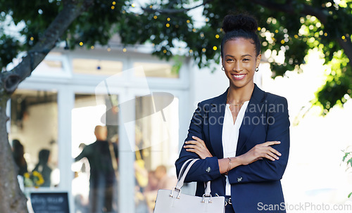 Image of Business woman, outdoor and portrait with arms crossed and confidence in the city. African female person, travel and urban building with a worker with proud, motivation and vision with a smile