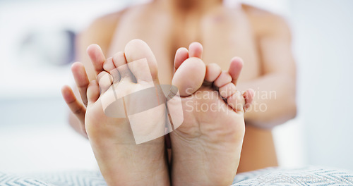 Image of Skincare, moisturizer and feet of woman on bed for smooth, pedicure or healthy skin at home. Dermatology, podiatry and closeup of foot of female person for body care, wellness and health in bedroom