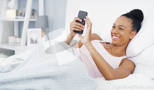 Image of Phone, laughing and woman in bed online for social media post, internet humor and funny text message. Morning, home and female person relax in bedroom on smartphone for mobile app, website and meme