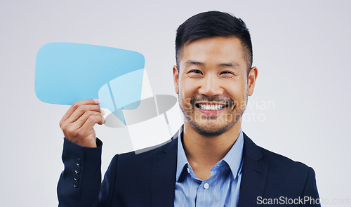 Image of Happy asian man, portrait and speech bubble for social media, question or FAQ with smile against a white studio background. Excited male person smiling with sign for comment, message or mockup space