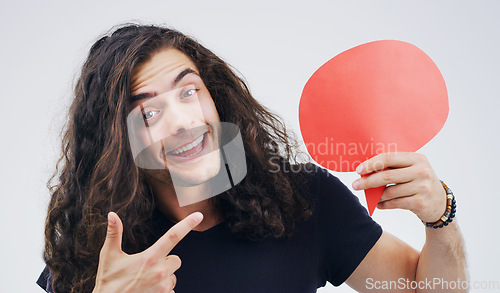 Image of Man, speech bubble and point in studio portrait with smile, opinion or social media by white background. Gen z guy, poster or paper sign for vote, review and mockup with promo for ideas, news or chat