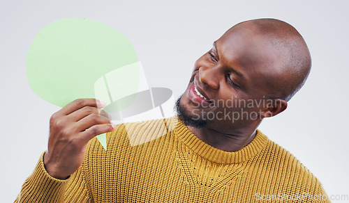 Image of African man, speech bubble and studio with idea, smile and opinion for social media by background. Gen z guy, poster or paper sign for vote, review and mock up with happiness for ideas, news or chat