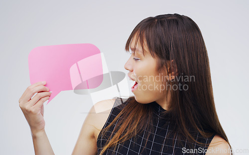 Image of Surprised, woman with speech bubble and against a white background. Communication or conversation, social media or announcement and person with wow or shock reaction in a studio with voice opinion