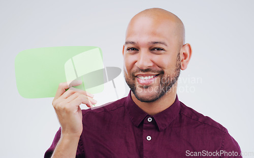 Image of Happy man, portrait and smile with speech bubble for question, social media or FAQ against white studio background. Male person smiling with shape, symbol or sign for comment, message or mockup space