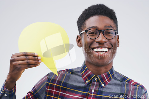 Image of Happy black man, portrait and speech bubble for social media, question or FAQ against a white studio background. Excited African male person with smile or sign in comment, message or mockup space