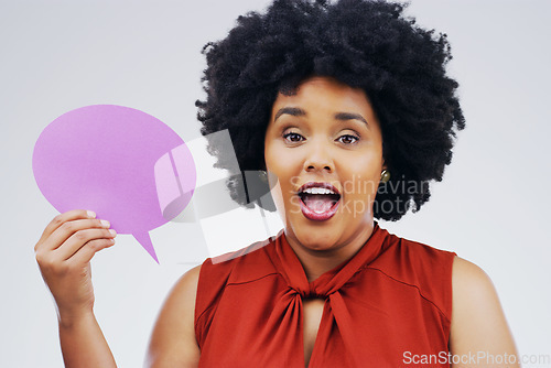 Image of Happy woman, portrait and speech bubble for question, surprise or social media against a white studio background. Female person smiling with afro or sign for comment, message or FAQ on mockup space