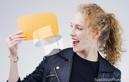 Image of Woman, speech bubble and social media with mockup space and online branding on white background. Communication, excited about announcement and happy female person with news and advertising in studio
