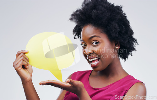 Image of Happy black woman, portrait and speech bubble for social media, surprise or question against a white studio background. African female person with afro or sign for comment or FAQ on mockup space