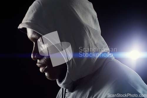 Image of Fitness, night and face of black man with focus in city for workout, exercise and marathon training. Sports, strong and profile of male athlete with dedication, motivation and serious for running