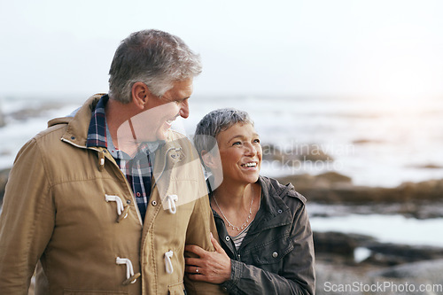 Image of Senior couple, relax and beach walk outdoor with smile from marriage and love. Happy, elderly people and mockup by a ocean and sea on holiday with travel and walking on vacation with retirement