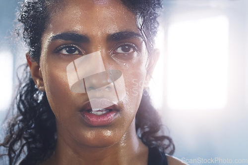 Image of Sweating, woman breathing and face taking a break from fitness, exercise and workout. Gym, Indian female person and tired face of an athlete after sports and wellness club training for health