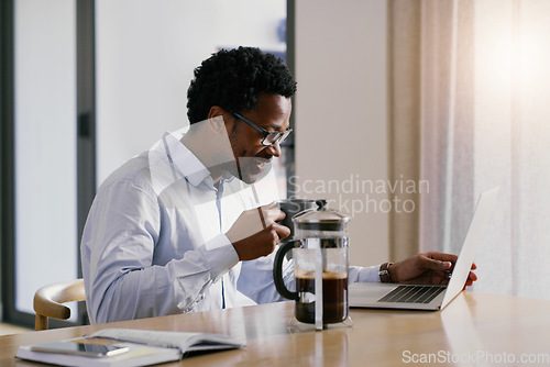 Image of Black man, coffee and laptop with a web call and meeting of freelancer worker at a table. Work from home, email and morning with a African male person on a computer for webinar and video conference