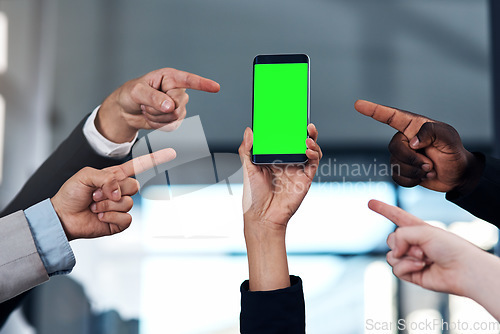 Image of Green screen, pointing and business people with phone in office for branding, contact us and mobile app. Mockup space, communication and hands point for social media, advertising or website promotion