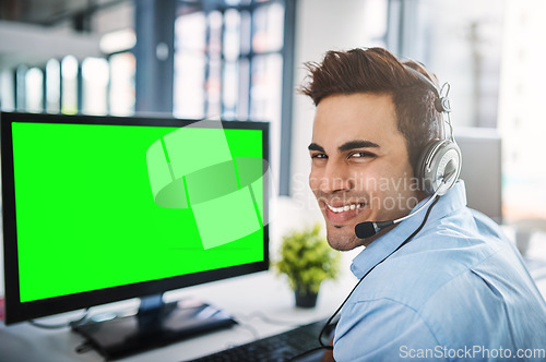 Image of Businessman face, call center and green screen on computer in customer service or telemarketing at office. Portrait of man person, consultant or agent smiling on PC with chromakey or mockup display