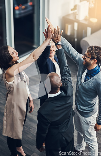 Image of Teamwork, high five and success with business people in office for support, winner and motivation. Collaboration, diversity and community with group of employees for solidarity, target and goals