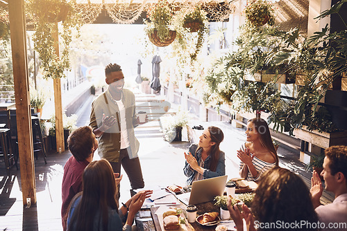 Image of Restaurant, business people and black man in meeting applause for discussion, planning and communication. Cafe, staff lunch and men and women clapping hands for team building, collaboration and ideas