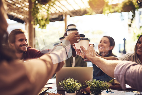 Image of Team building, cheers and people with coffee in a meeting or discussion for a creative project in a cafe. Diversity, collaboration and professional employees with a latte for a toast in a restaurant.