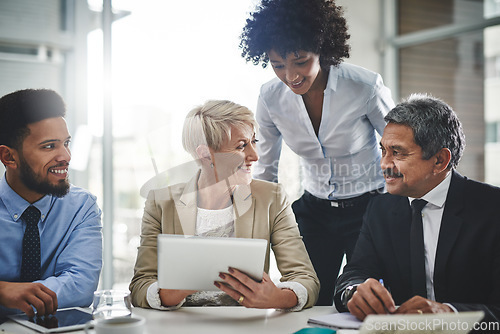 Image of Business woman, meeting and tablet planning with company contract and deal with conversation. Staff, communication and paperwork with a team with diversity coworkers working on a job strategy