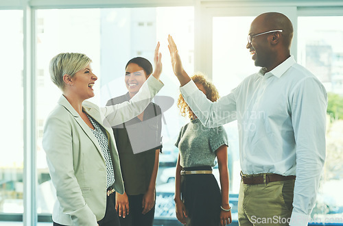 Image of High five, winner and motivation with business people in office for success, happy and agreement. Support, goals and target with group of employees for teamwork, celebration and solidarity