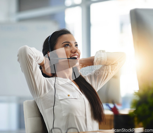 Image of Relax, smile or happy woman in call center consulting, speaking or talking at customer services. Virtual assistant, stretching or female sales consultant in telemarketing or telecom company help desk