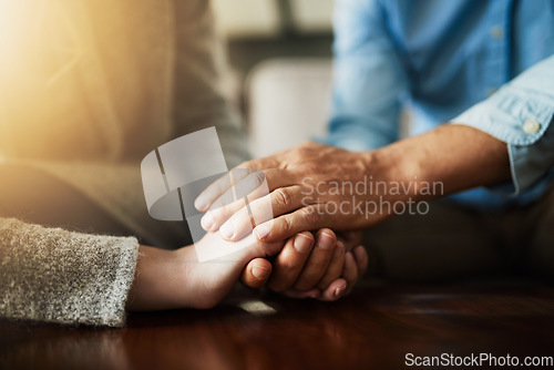 Image of Holding hands, senior couple and life insurance support with kindness in a house. Home, love and elderly people with empathy, hope and trust with solidarity for grief care and marriage together