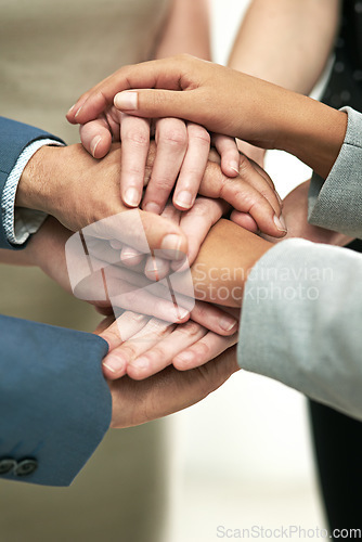 Image of Business people, meeting and hands together in trust for team collaboration at office. Hand of group piling for teamwork motivation, agreement or support in solidarity for company goals at workplace