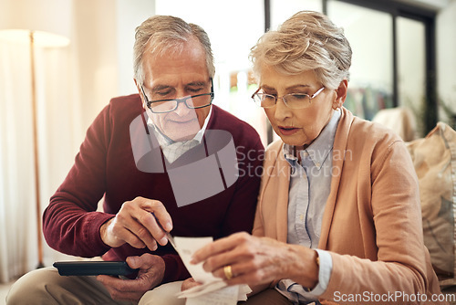 Image of Financial, investment and budget with an old couple in their home for retirement or pension planning. Debt bills, money or insurance with a senior man and woman in their house for finance strategy