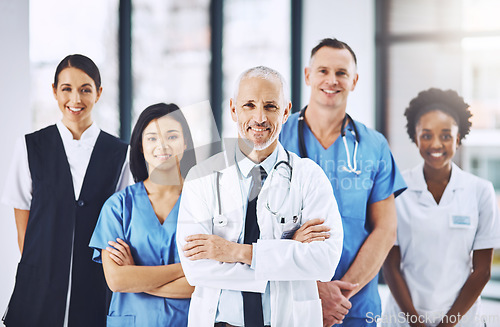 Image of Teamwork, healthcare and portrait of doctors with nurses in hospital with arms crossed for leadership or support. Health, people and happy medical team with solidarity in collaboration at a clinic