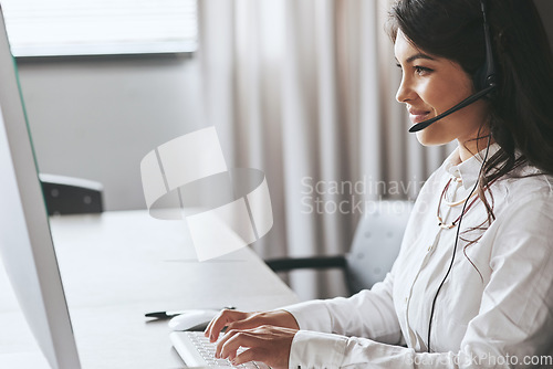Image of Business woman, computer and telemarketing employee with a smile and help on a crm call. Call center, customer service and young female person working on a web support consultation with happiness