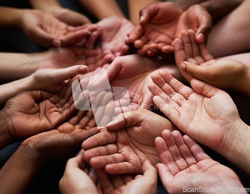 Image of People, diversity and open palm with support in a community with unity and care. Group, helping and hands together for charity with donation and global solidarity for poverty with diverse team.