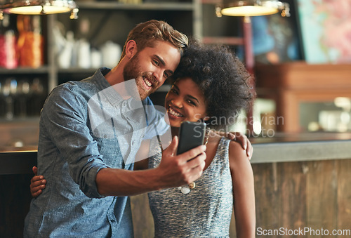 Image of Coffee shop selfie, cafe hug and happy people or couple of friends post photo memory to social network. Customer smile, retail service picture and person pose in startup, small business or restaurant