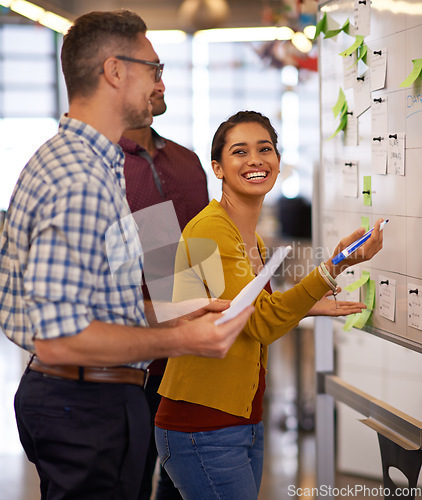 Image of Brainstorm, smile and team on whiteboard or employees or presentation for male and female coach in office. Lady trainer, man workers and Flipchart or project for business or meeting and workplace