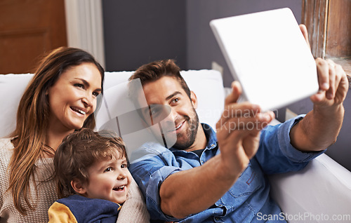 Image of Video call, tablet and family on social media in a home together and relax using the internet or an online app. Living room, website and parents with kid or child in happiness and smile for a picture