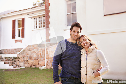 Image of New home, portrait and couple hug for house, real estate building and property purchase, sale or mortgage investment. Happiness, love and smiling man, woman or people embrace for homeowner relocation