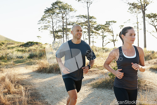 Image of Forest, fitness and running couple training, workout and doing morning exercise for health and wellness together. Sport, man and woman runner run with athlete on a mountain for sports or energy