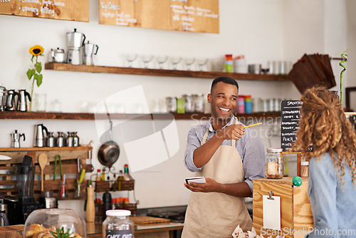 Image of Barista man, woman and happiness for order with smile, notes and service for good customer experience. Waiter, pen and lady with pointing, sale or special on menu in restaurant, cafe or coffee shop