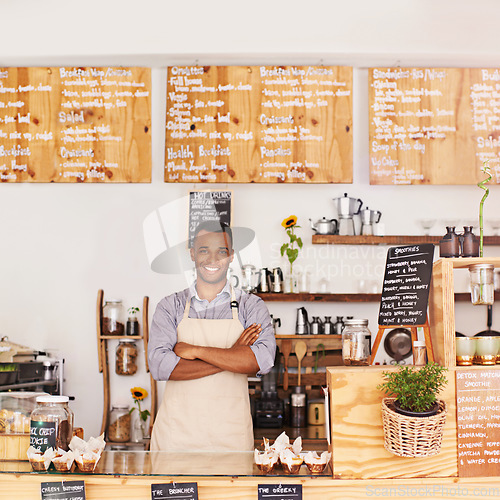 Image of Portrait, black man and waiter with arms crossed in cafe with pride for career or job. Barista, smile and confidence of African person from Nigeria as restaurant owner, small business and coffee shop