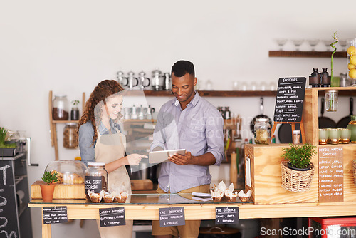 Image of Restaurant owners, tablet and teamwork of people, manage orders and discussion in store. Waiters, black man and happy woman in cafe with technology for inventory, stock check and managing sales.