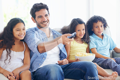 Image of Happy family, relax father and children watching tv, subscription comedy movie or streaming home entertainment. Bonding, remote control and house kids, dad or people with popcorn and television show