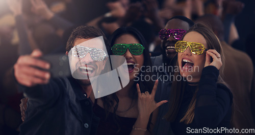 Image of Selfie, sunglasses and friends at party for celebration, festival and dance at social event. Night club, disco and happy men and women take picture for memories, post and celebrate new years eve