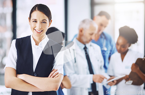 Image of Healthcare, hospital and portrait of woman with arms crossed, smile and happiness with support in clinic. Health care, manager and medicine, confident and happy face of nurse or medical professional.