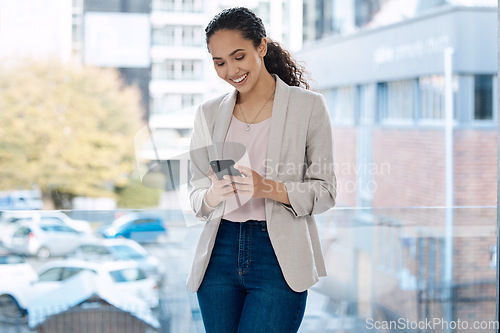 Image of Phone, smile and business woman in office for networking, communication app and social media. Technology, internet and text message with female employee by window for professional, website and email