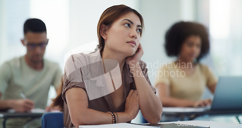 Image of Education, depression and girl university student in a classroom bored, adhd or daydreaming during lecture. Thinking, anxiety and female learner distracted in class, contemplation, boredom or sad