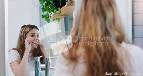 Image of Mirror, dental floss and girl in a bathroom for cleaning, hygiene and oral care in her home. Teeth, flossing and female person in apartment for morning, routine and fresh, breath and mouth treatment