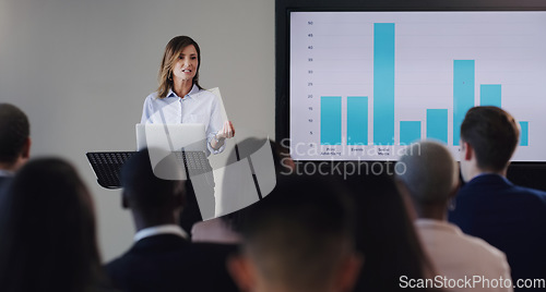 Image of Woman speaker, presentation or business screen of graphs at seminar, workshop or training. Professional men, women or conference with a podium for learning, knowledge and discussion for sales growth