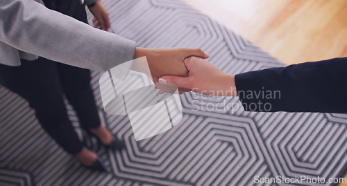 Image of Handshake, business women and agreement to deal, partnership or b2b negotiation. Above professional people shaking hands for a client thank you, congratulations or hiring employee as HR partner